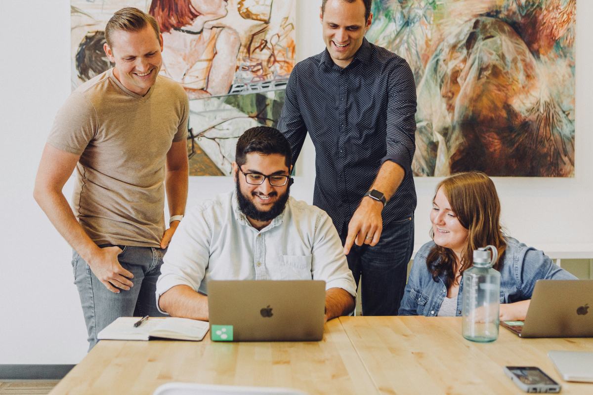 Employees working on a laptop