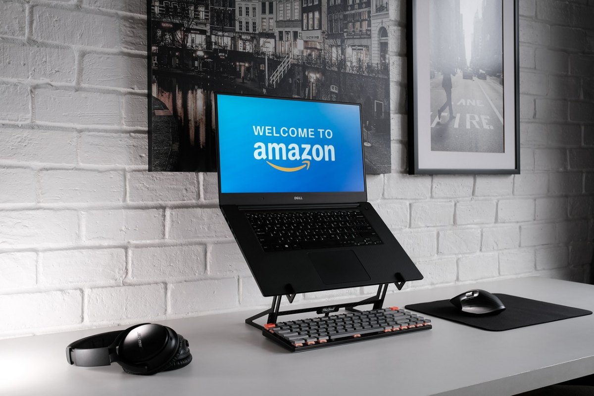 Laptop displaying _Welcome to Amazon_