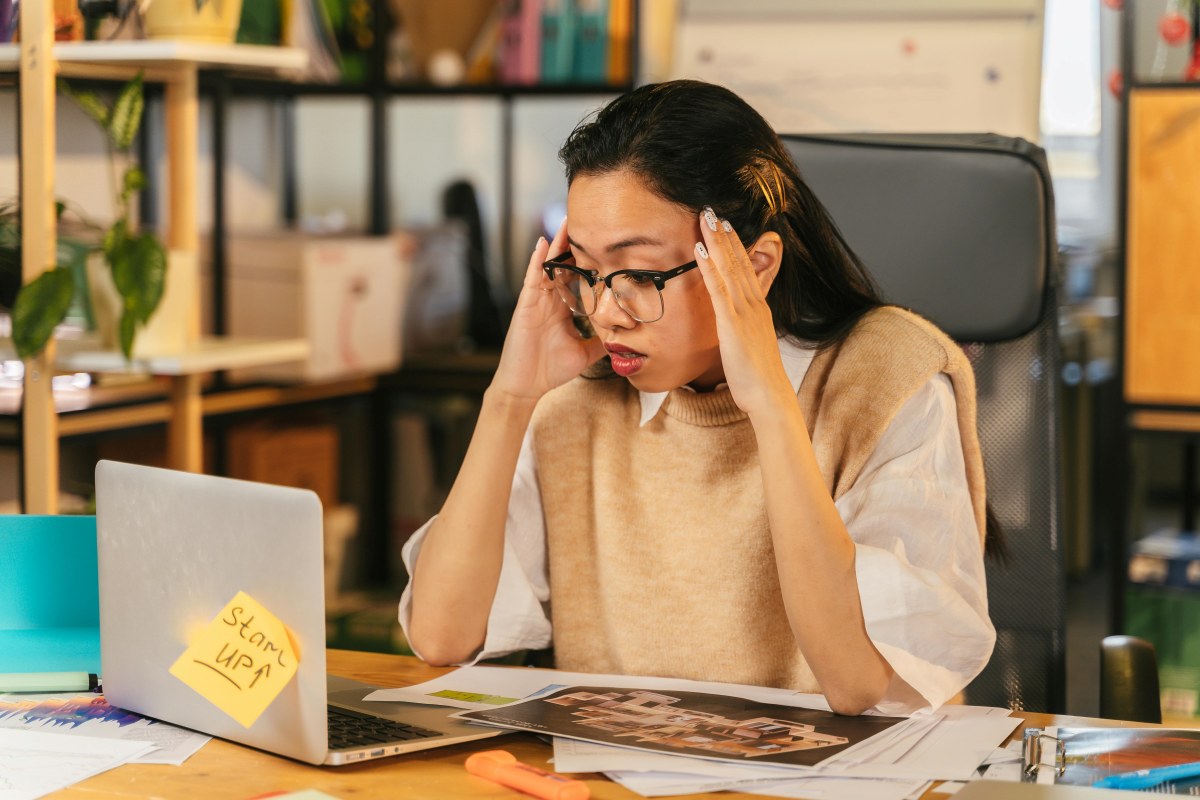 Woman feeling stressed at work