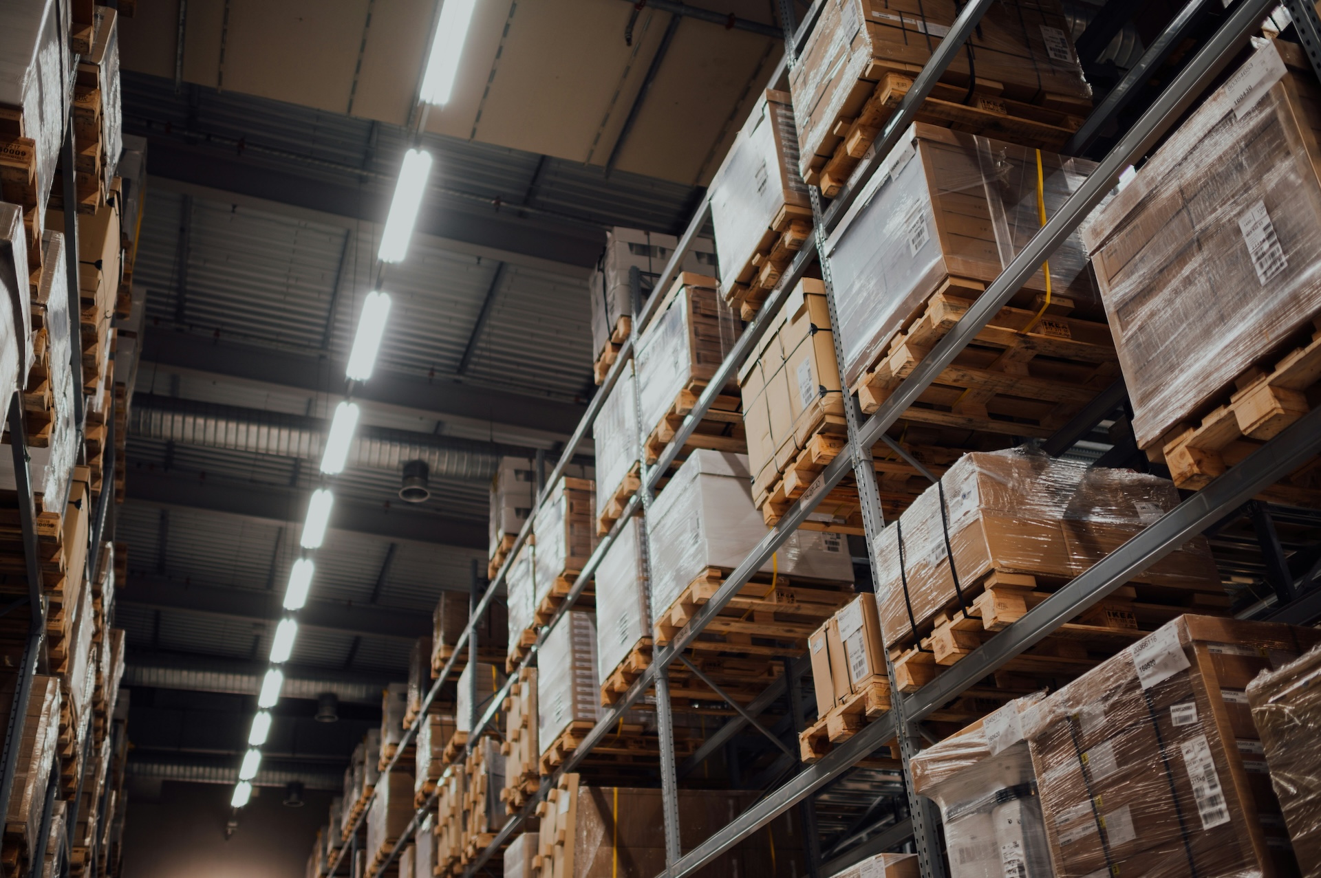 brown cardboard boxes at amazon business on white metal rack