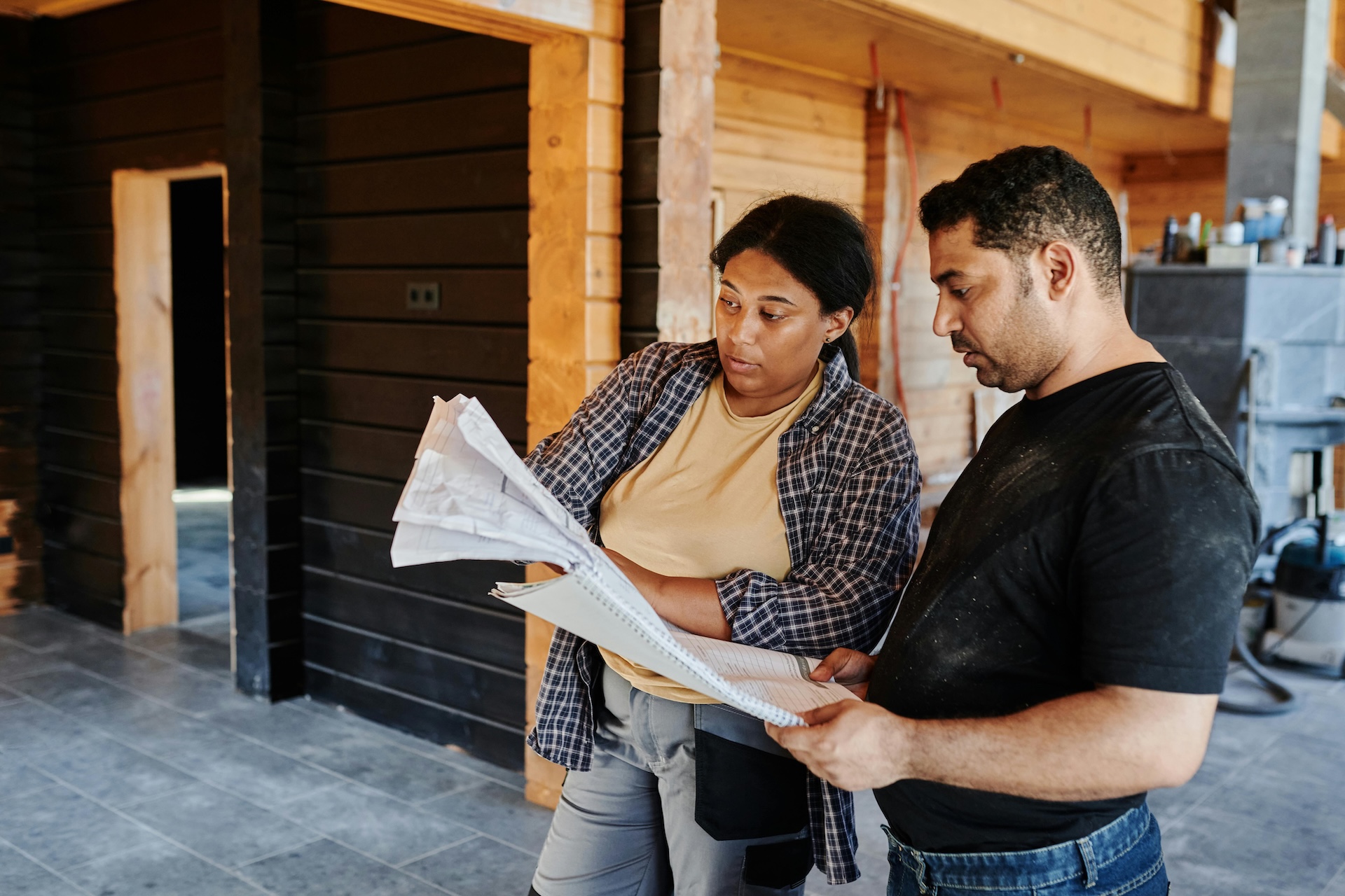 client looking over building plans for construction loan