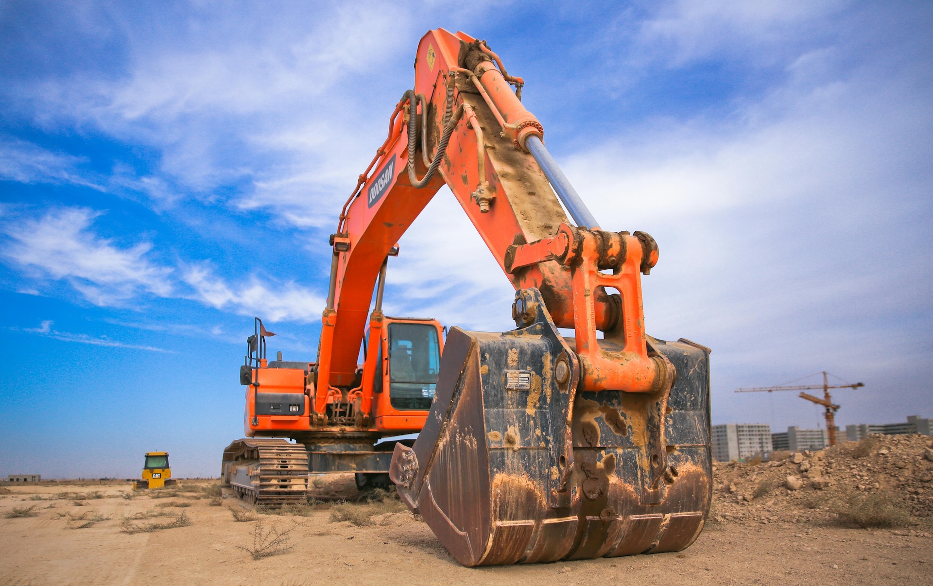 digger for construction as part as part of a business acquisition loan