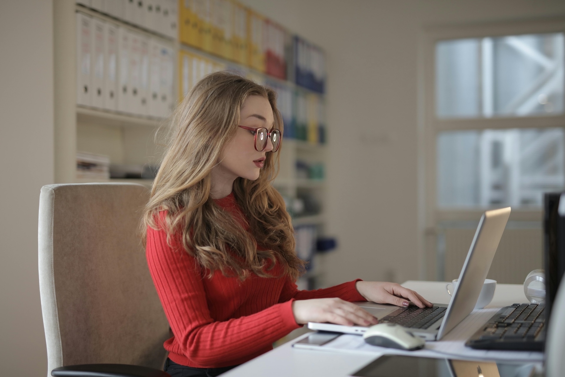 focused woman working on business accounts with amazon business