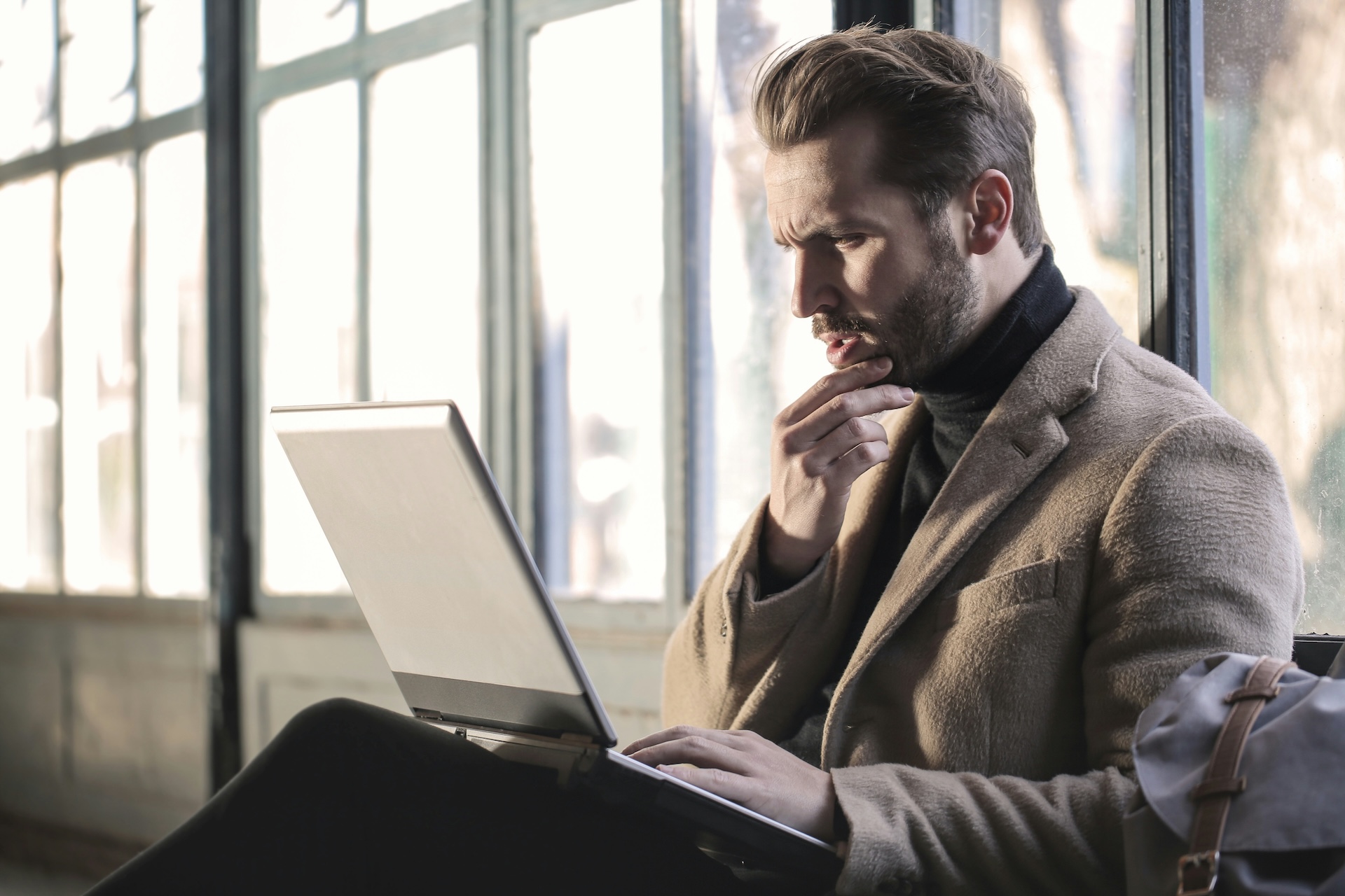 man checking his credit score for a buisness loan for bad credit