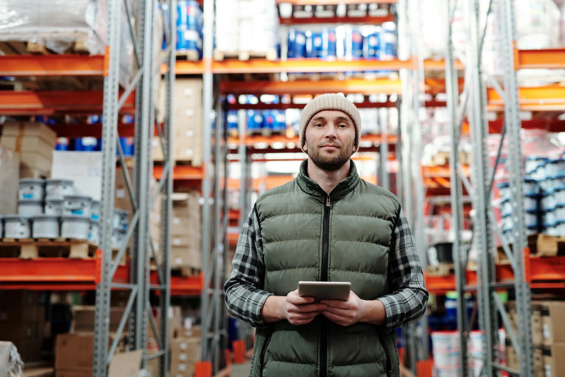 man working in warehouse monitoring working capital