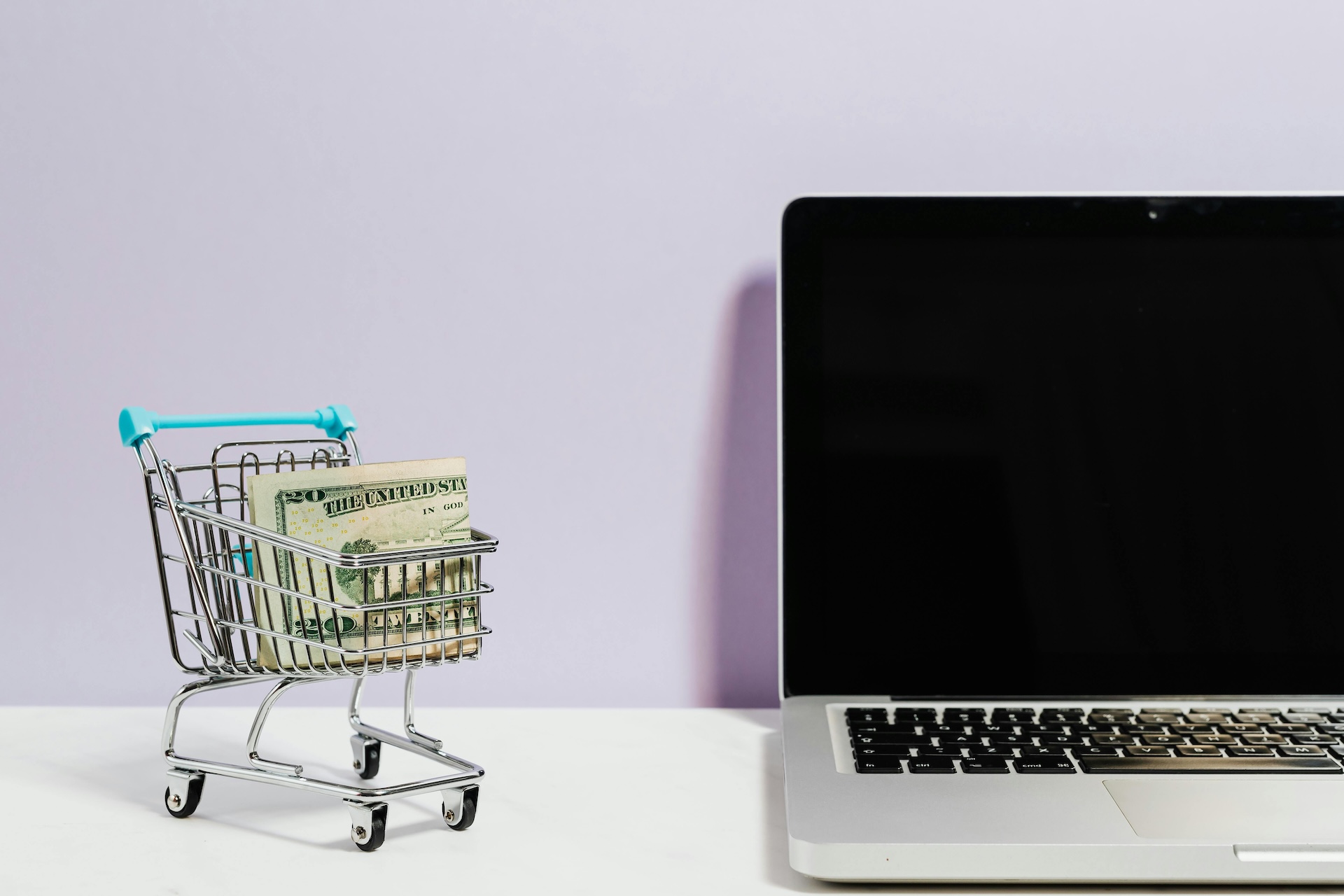 shopping cart for amazon business next to a laptop