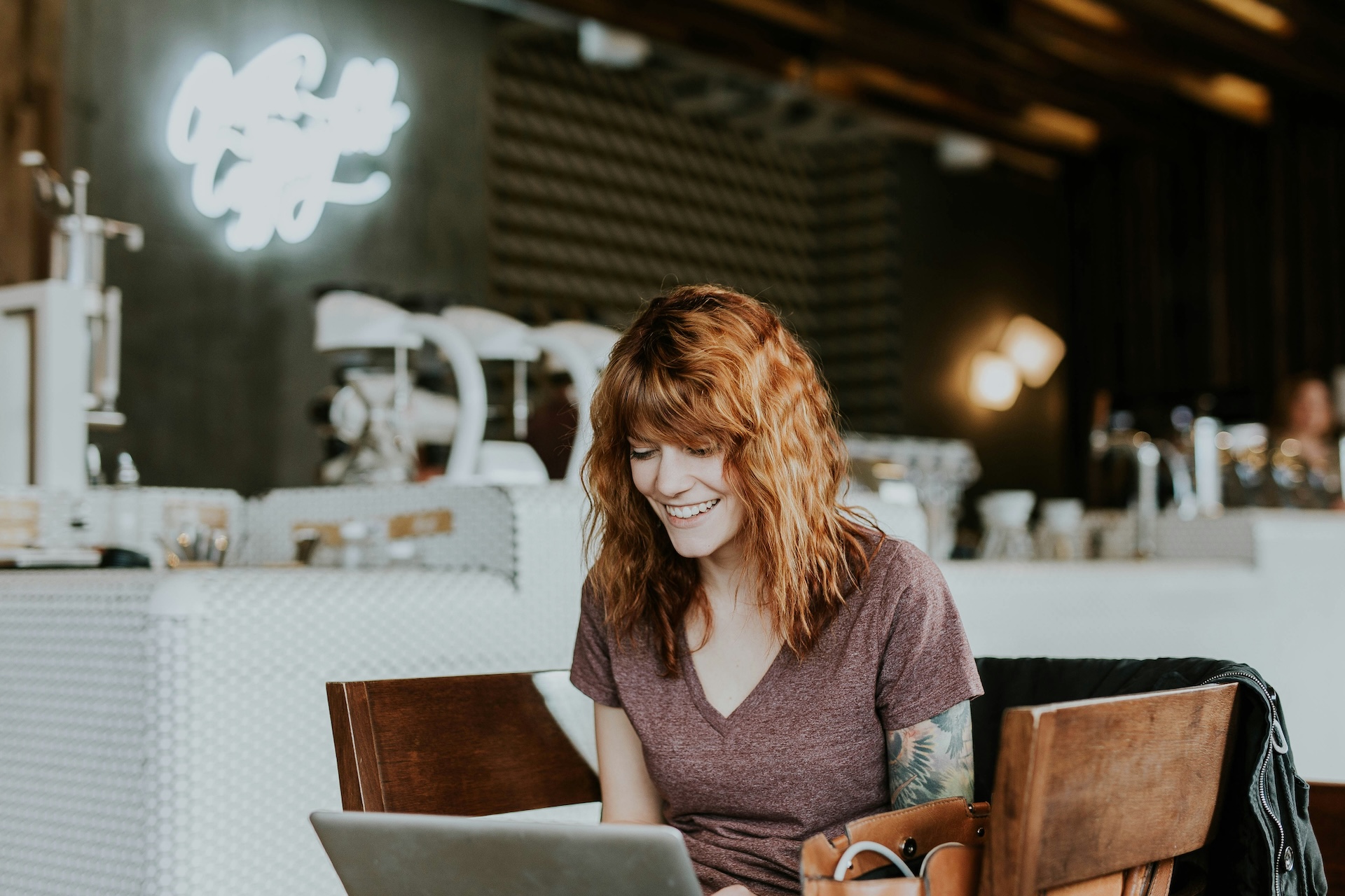 woman working on laptop happy about paypal working capital loan