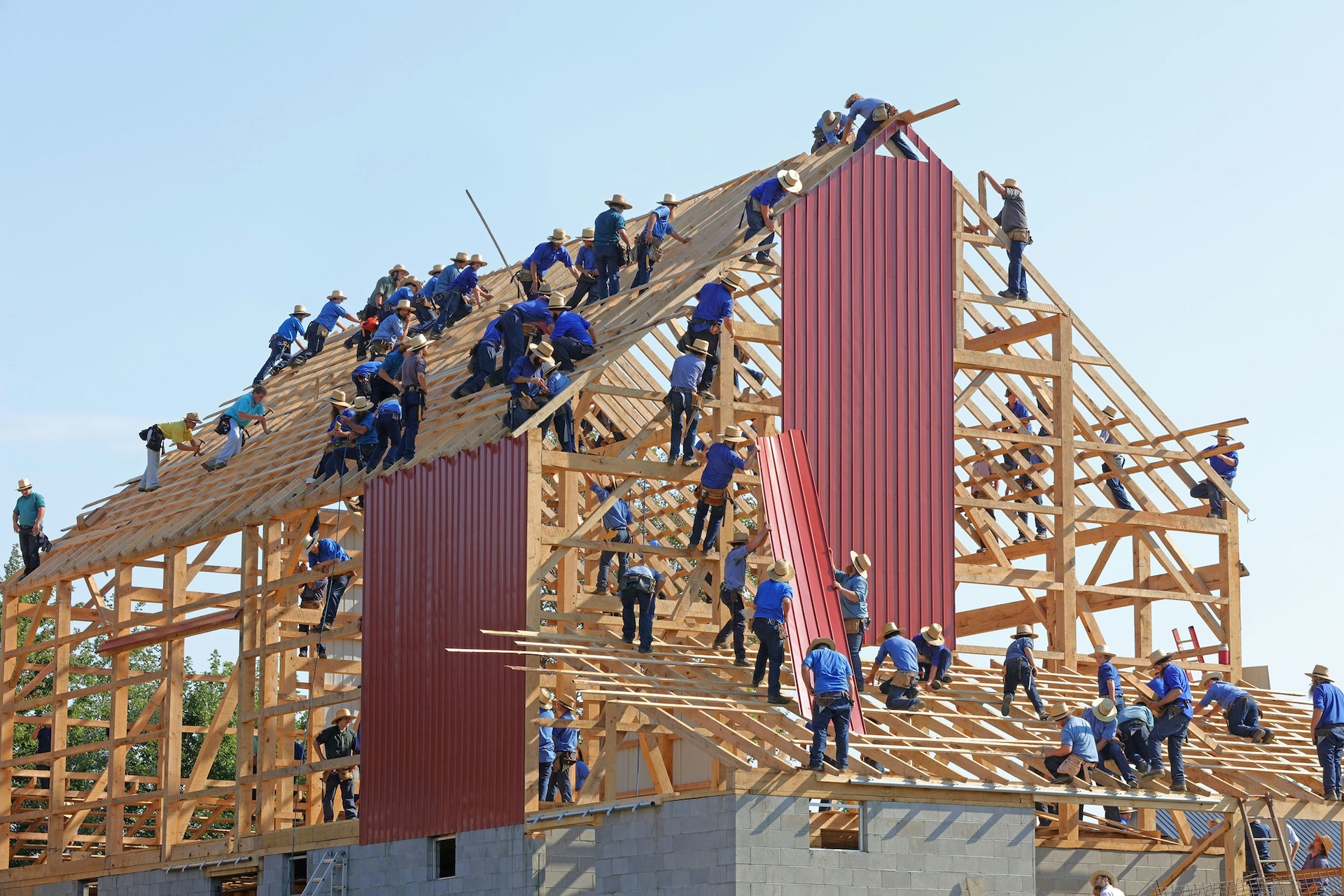 workers on the frame of a building